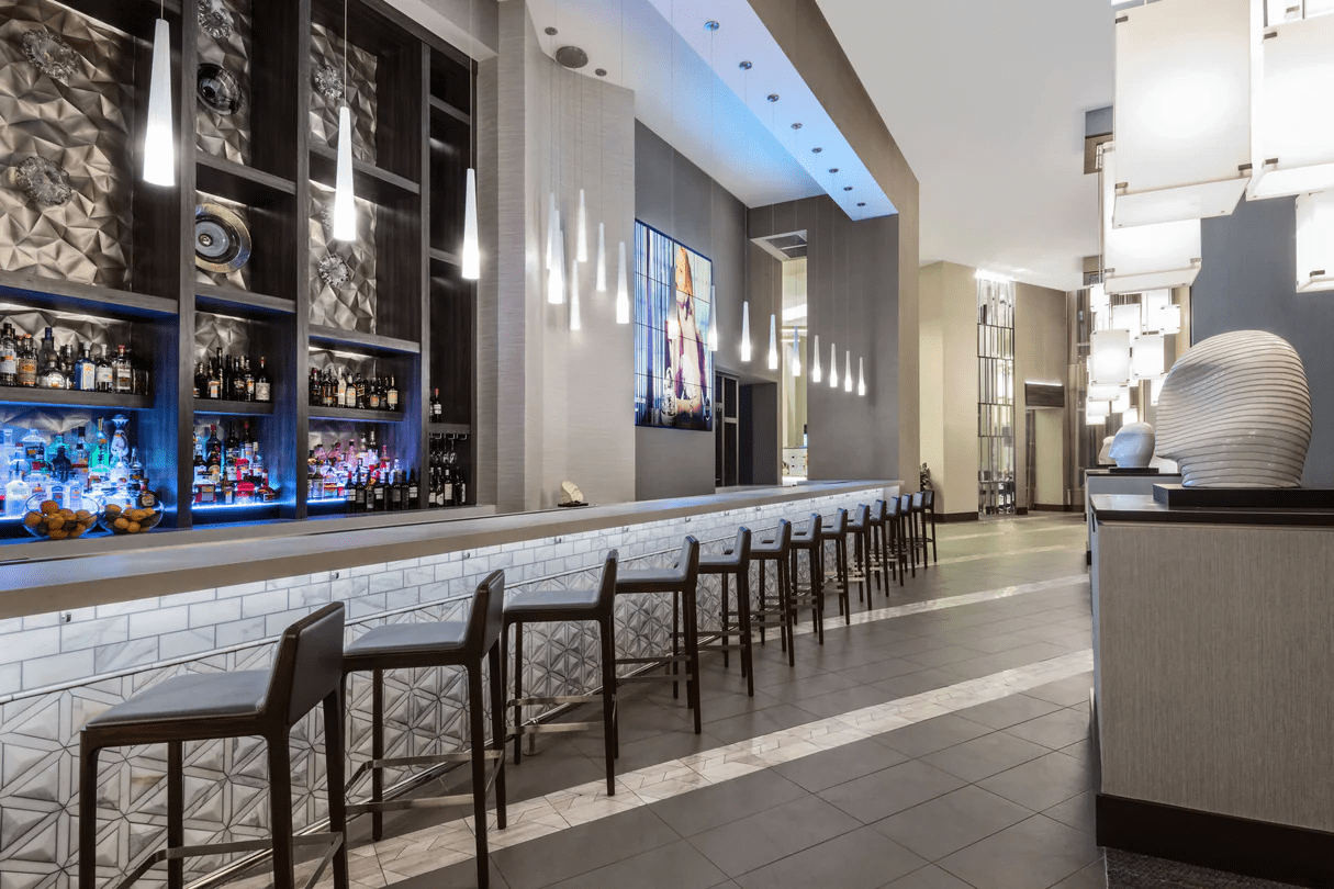 Rooftop bar at the AC / Residence Inn Charlotte with seating overlooking the city